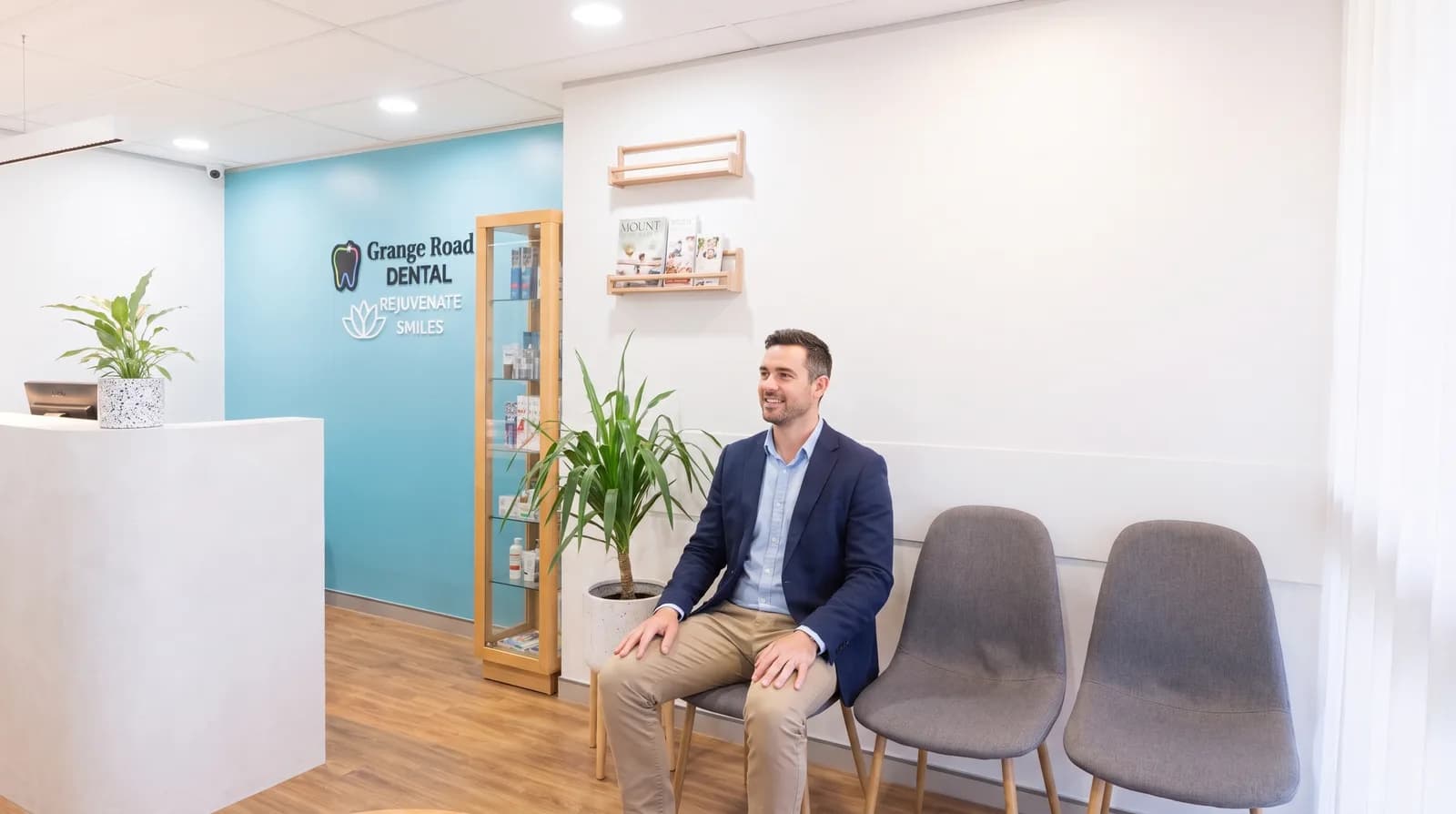 A calm, relaxed patient waiting comfortably in a warm reception before a dental sedation appointment at Grange Road Dental